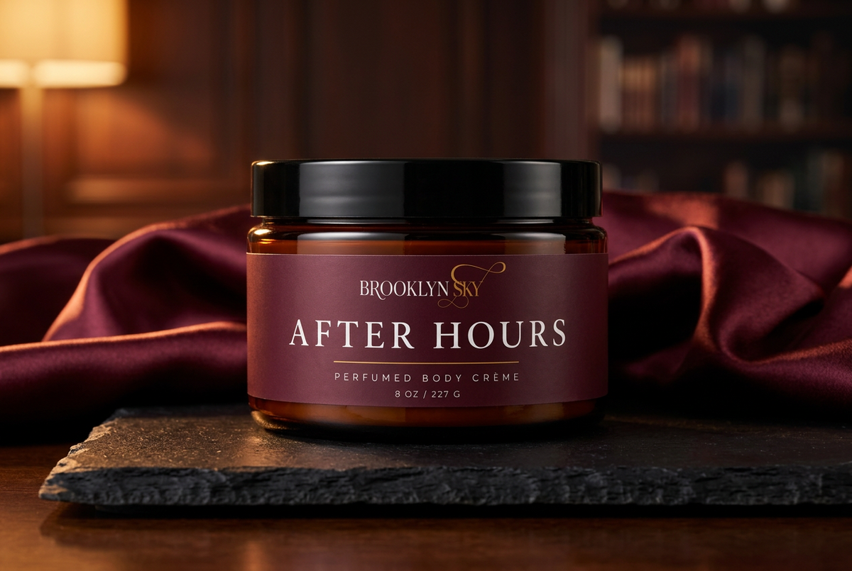 After Hours Body Crème editorial lifestyle on black stone with burgundy satin